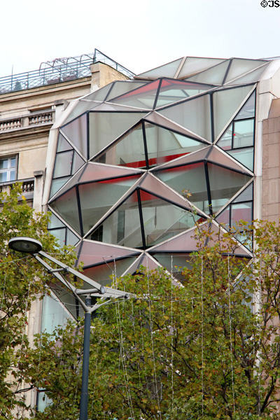 Faceted window wall of former Citroen auto showroom on Champs Elysees. Paris, France.
