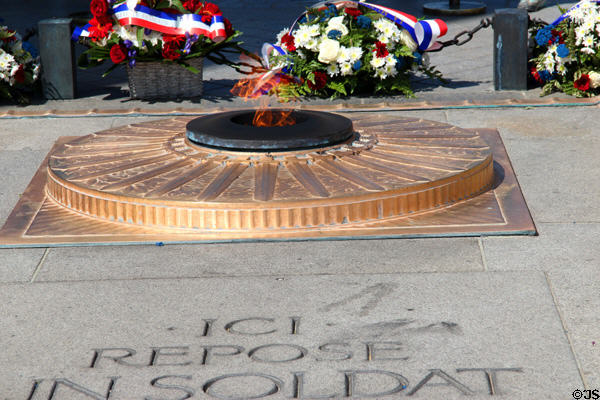 Eternal flame of Tomb of the Unknown Soldier at Arc du Triomphe. Paris, France.