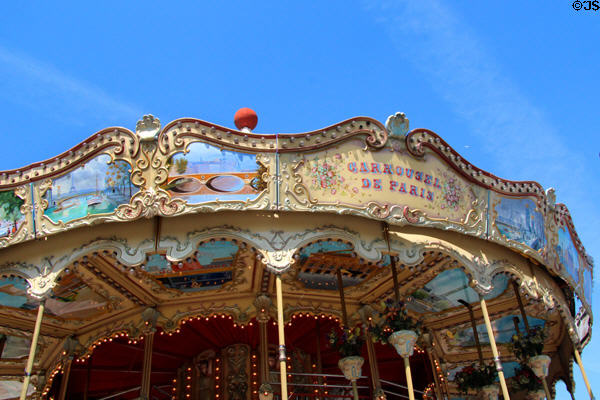 Paris street scenes painted on overhang of Trocadero Carrousel. Paris, France.