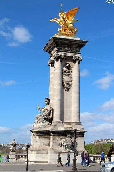Fame of Industry restraining Pegasus sculpture (1900) by Clément Steiner over France of Renaissance sculpture (1900) by Jules Coutan on Pont Alexandre III. Paris, France.