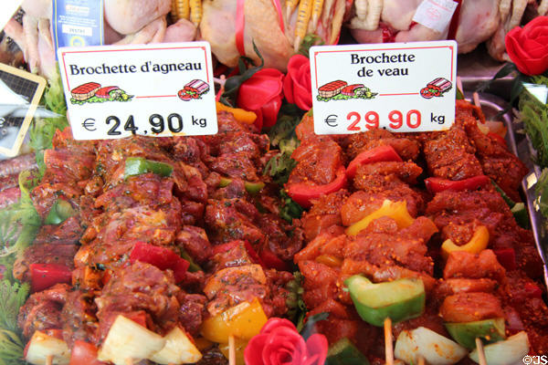 Brochettes of lamb & veal in butcher shop. Paris, France.
