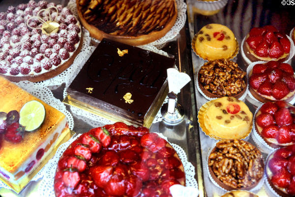 Rows of cakes & tarts at pastry shop. Paris, France.