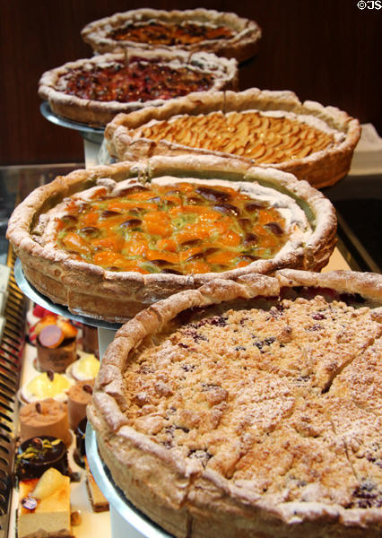 Row of fruit tarts at pastry shop. Paris, France.