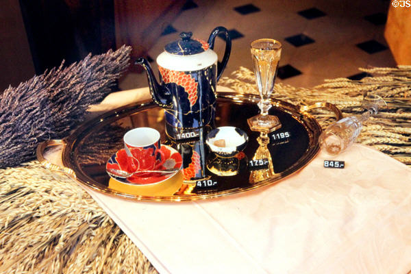 Modern coffee service on tray in shop window. Paris, France.