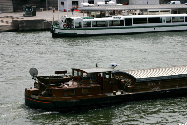 Barge traffic on Seine. Paris, France.