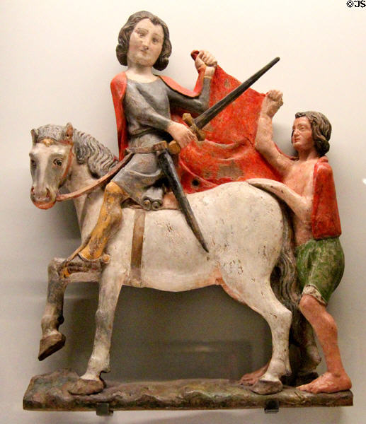 St Martin sharing his cloak wood carving (14thC 2nd quarter) at Museum of Decorative Arts. Paris, France.