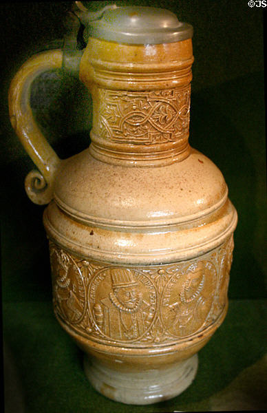 Stoneware covered drinking flask with Low Countries royal portraits at Museum of Decorative Arts. Paris, France.