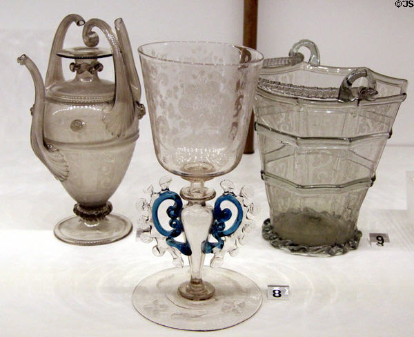 Venetian glass flask (16thC), drinking glass on stem decorated with wings (17thC) & glass bucket (end 16thC) at Museum of Decorative Arts. Paris, France.