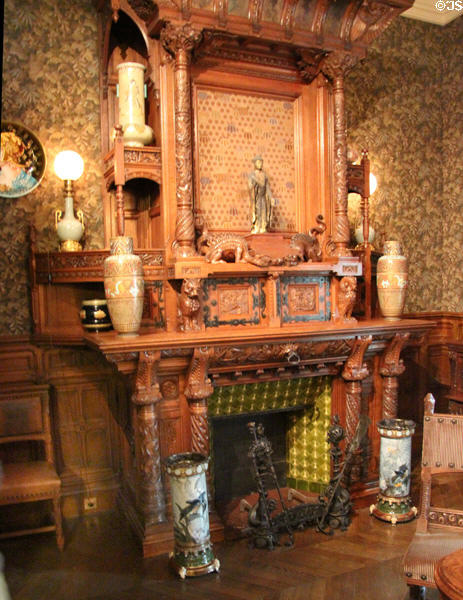 Carved oak & tile fireplace (1880-5) by cabinetmaker Fulgraff of Paris at Museum of Decorative Arts. Paris, France.
