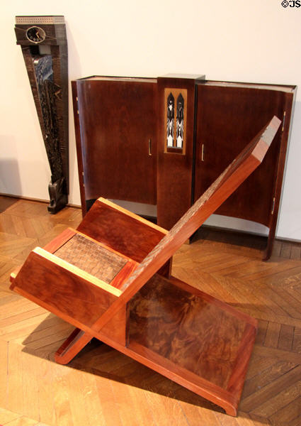 Reading armchair with fixed reclining back & flip up light source (1925-8) by Pierre Legrain at Museum of Decorative Arts. Paris, France.