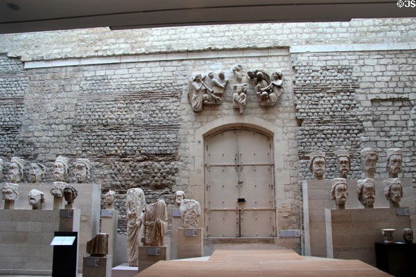 Ancient wall original to site with collection of portrait heads of kings found at Notre Dame of Paris at Cluny Museum. Paris, France.