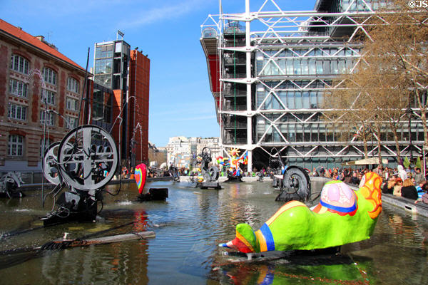 Stravinsky Fountain (1983) with black mechanical sculptures by Jean Tinguely & colored pieces by Niki de Saint Phalle at Georges Pompidou Center. Paris, France.