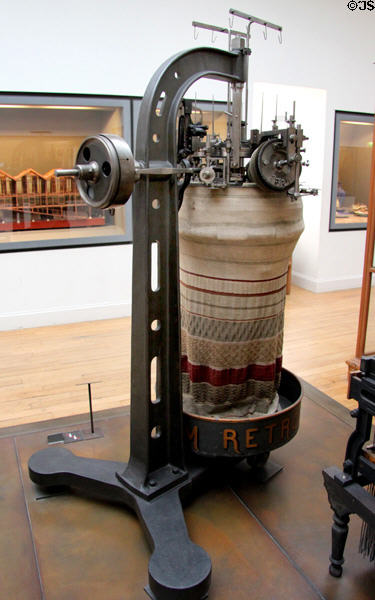 Two-system circular loom for weaving cylinders like socks (c1890) by Emanuel Buxtorf at Arts et Metiers Museum. Paris, France.