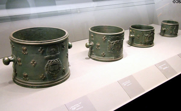 Five standard bronze measures for grains (c1670-5) from Paris with double L symbol of Louis XIV at Arts et Metiers Museum. Paris, France.