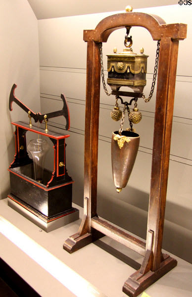 Lab device to study transmission of pressure in liquids (late 18thC) & large natural magnet (late 18thC) at Arts et Metiers Museum. Paris, France.