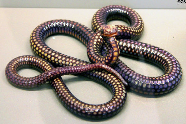 Iridescent glass snake (mid 19thC) by Pantin Crystal Works at Arts et Metiers Museum. Paris, France.