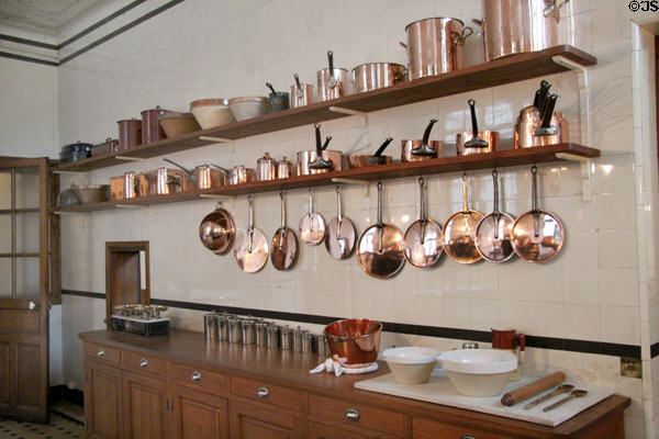 Copper cooking pots in kitchen at Nissim de Camondo Museum. Paris, France.