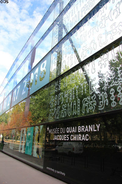Green glass wall signage at Musée du quai Branly. Paris, France.