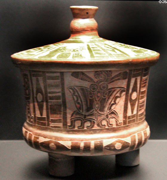 Terra cotta covered tripod vase with butterflies from Mexico City basin at Musée du quai Branly. Paris, France.