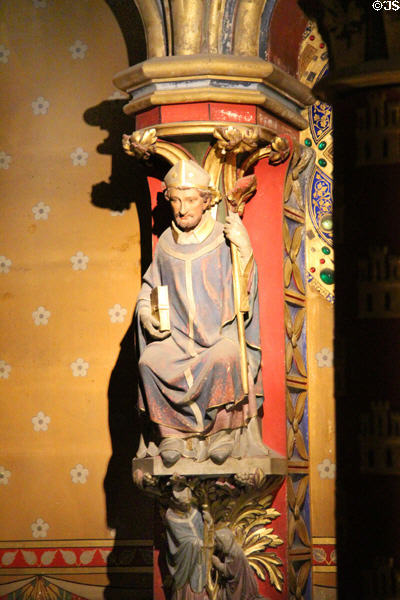 Carved bishop on Gothic column at St Chapelle. Paris, France.