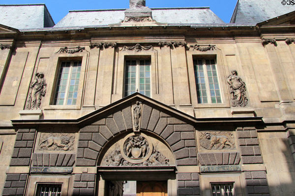 Lions framing main doorway by Jean Goujon at Carnavalet Museum. Paris, France.