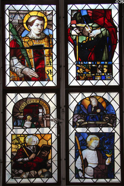 Stained glass window with religious themes at Carnavalet Museum. Paris, France.