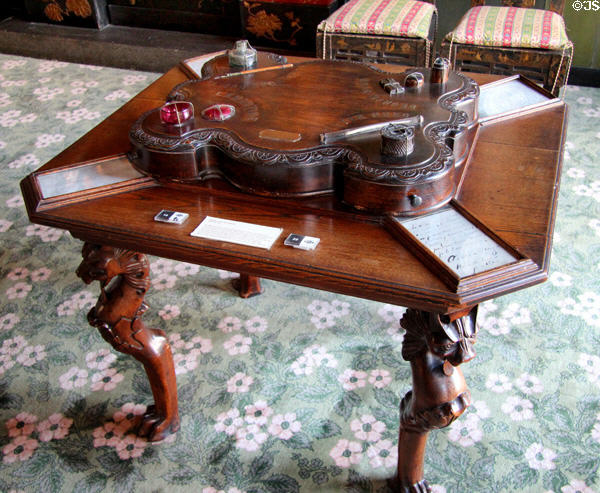 Writing set atop lion-legged table at Maison de Victor Hugo. Paris, France.