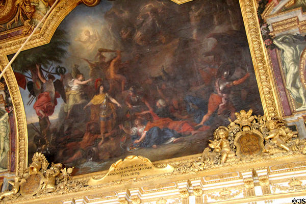 Ceiling painting by Charles Le Brun in Hall of Mirrors at Versailles Palace. Versailles, France.