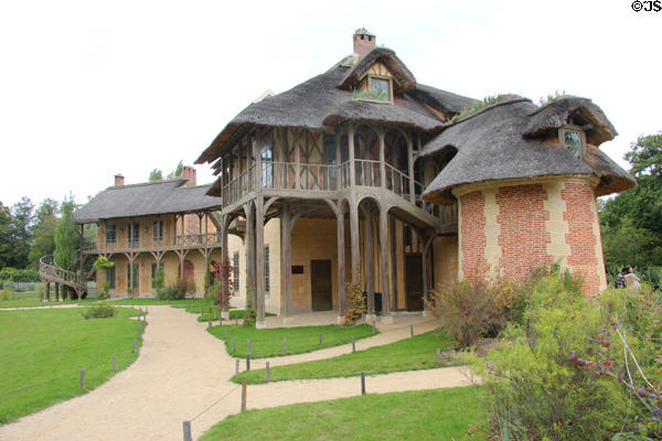 Queen's House with curved Billiard House beyond at Marie Antoinette farm. Versailles, France.