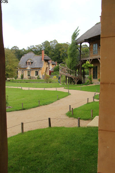 Billiard House with spiral staircase seen from Queen's House at Marie Antoinette farm. Versailles, France.