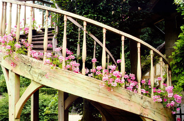 Flowers on spiral staircase of Billiard House at Marie Antoinette farm. Versailles, France.