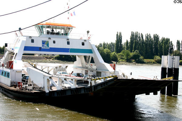 Ferry across Seine River coming into dock. Jumièges, France.