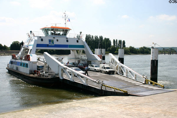 Cars unloading from ferry across Seine River. Jumièges, France.