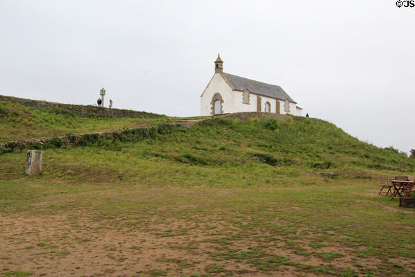 Saint-Michel Tumulus (constructed 5th millennium BCE), a Neolithic funerary monument & chapel. Carnac, France.