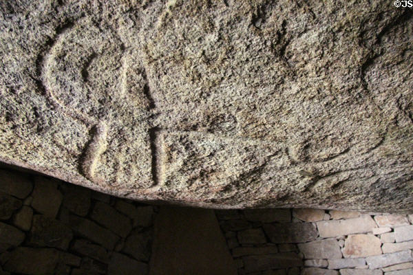 Designs carved in overhead stone inside funerary chamber of Merchants Table at Locmariaquer Megalithic site. Locmariaquer, France.