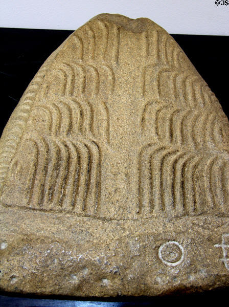 Replica of crosiers engraved on dolmen slab at Locmariaquer Megalithic site. Locmariaquer, France.