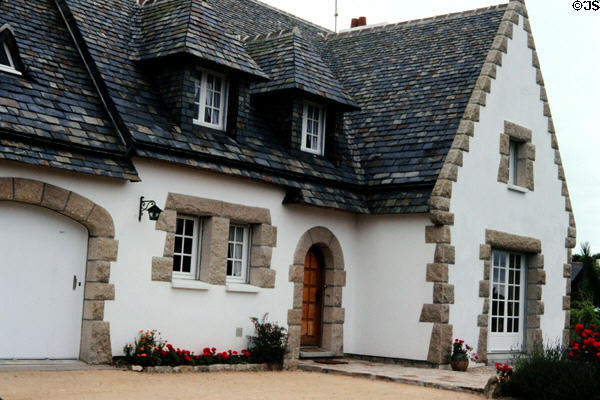 Typical Brittany dwelling with steep slate roof. Carnac, France.