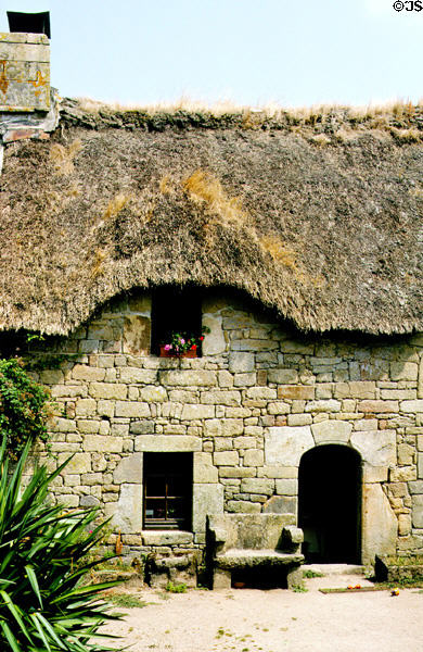 Brittany stone dwelling with thatched roof. Carnac, France.