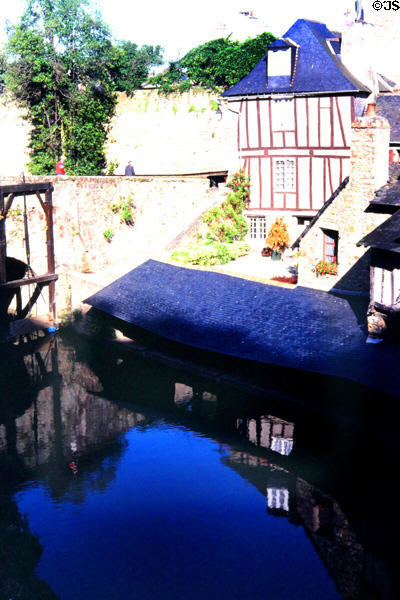 Half-timbered buildings over mill pond. Vannes, France.