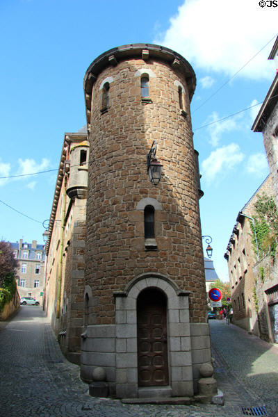 Round tower on ramped street leading up to ramparts. St Malo, France.
