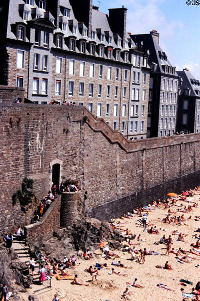 Ramparts & sun bathers. St Malo, France.