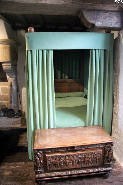 Curtained bed & ornate chest in Cartier's bedroom at Jacques Cartier Manor House Museum. St Malo, France.