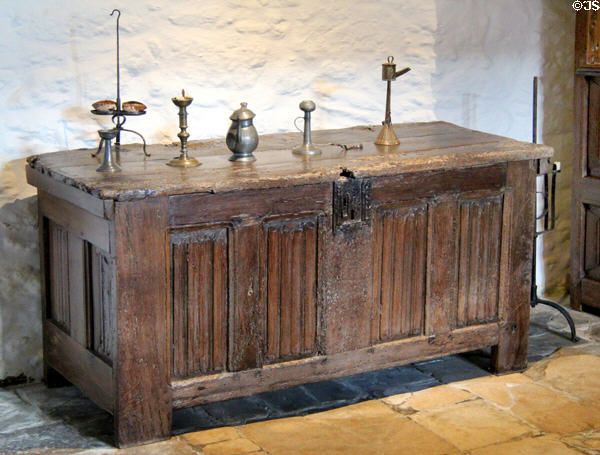 Chest carved with linen fold design supporting lighting devises at Jacques Cartier Manor House Museum. St Malo, France.