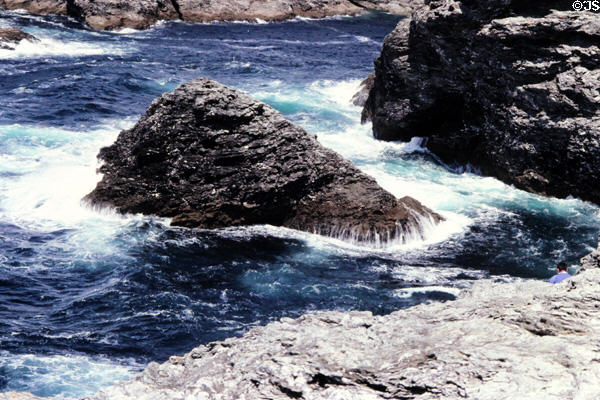 Waves breaking on rocky coastline around Port-Coton Needles. Belle-Isle-en-Mer, France.