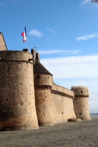 Bastions & section of wall above mud flats of Mont-St-Michel. Mont-St-Michel, France.