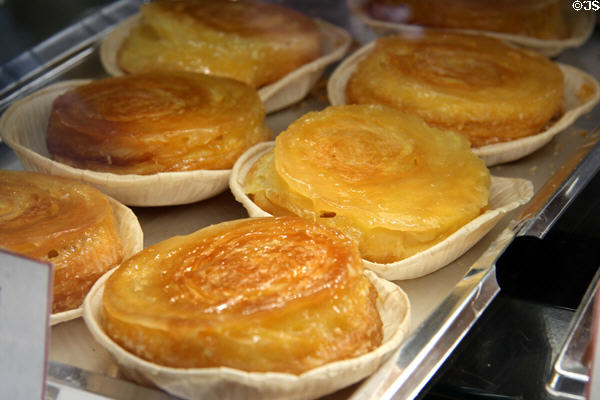 Shop window with flaky filled pastries along Grande Rue. Mont-St-Michel, France.