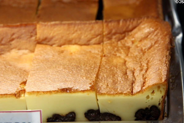 Shop window with custard crème filled pastry along Grande Rue. Mont-St-Michel, France.