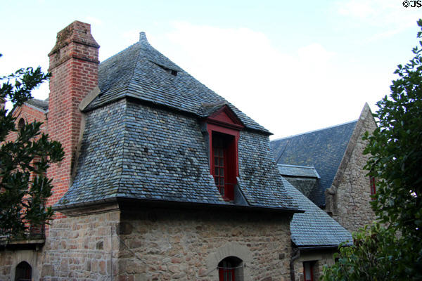 Old stone building with Mansard style roof. Mont-St-Michel, France.