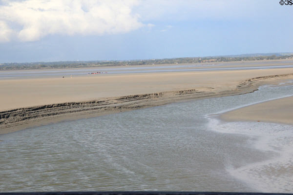 Water channel on tidal flats near city wall. Mont-St-Michel, France.