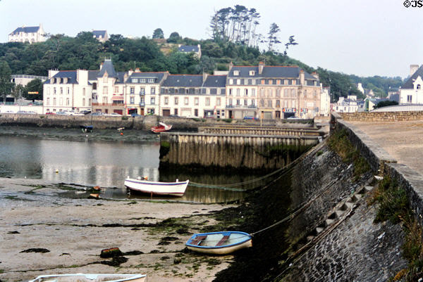 Small boats on seabed at low tide. Audierne, France.